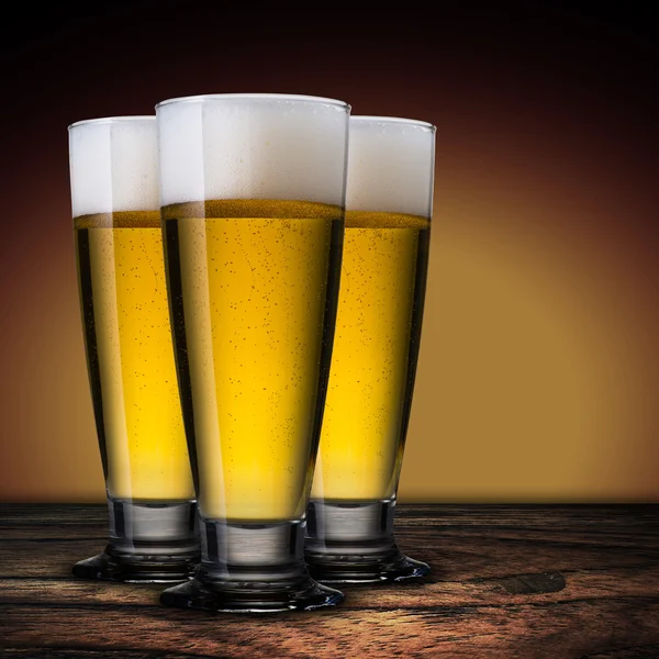 Cold beer glass on wood table — Stock Photo, Image