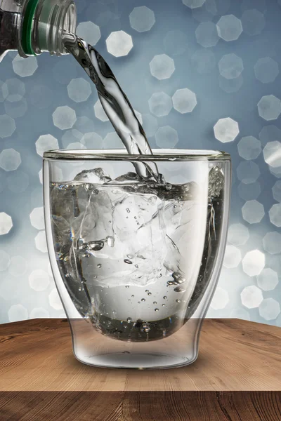 Water pour from water bottle to glass — Stock Photo, Image