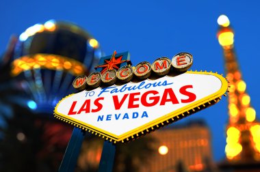 Las Vegas Sign with Vegas Strip in background clipart