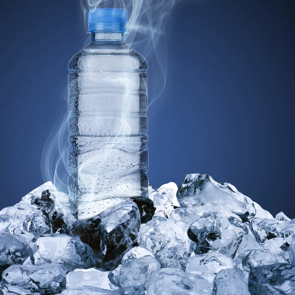 Water bottle on ice cube — Stock Photo, Image