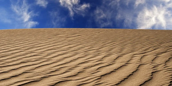 Sand desert with blue sky — Stock Photo, Image