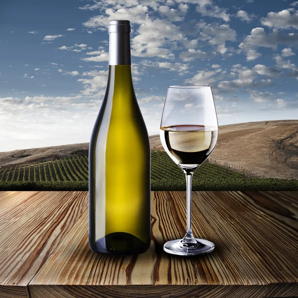 Bottle and glass of white wine — Stock Photo, Image