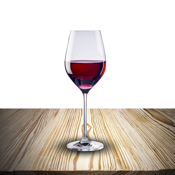 Glass of red wine on wood table — Stock Photo, Image