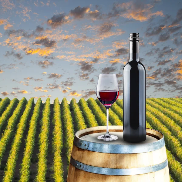 Red Wine in glass on wood barrel — Stock Photo, Image