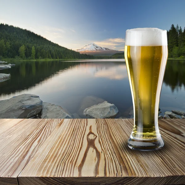 Glass of beer on wood — Stock Photo, Image