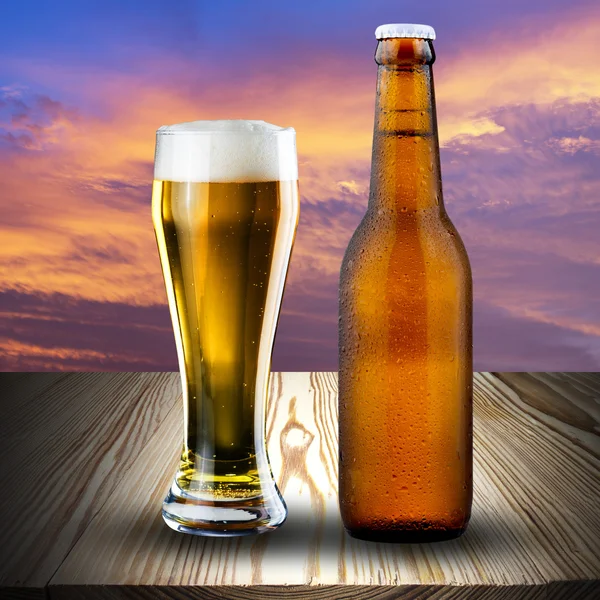 Bottle and glass of cold beer — Stock Photo, Image