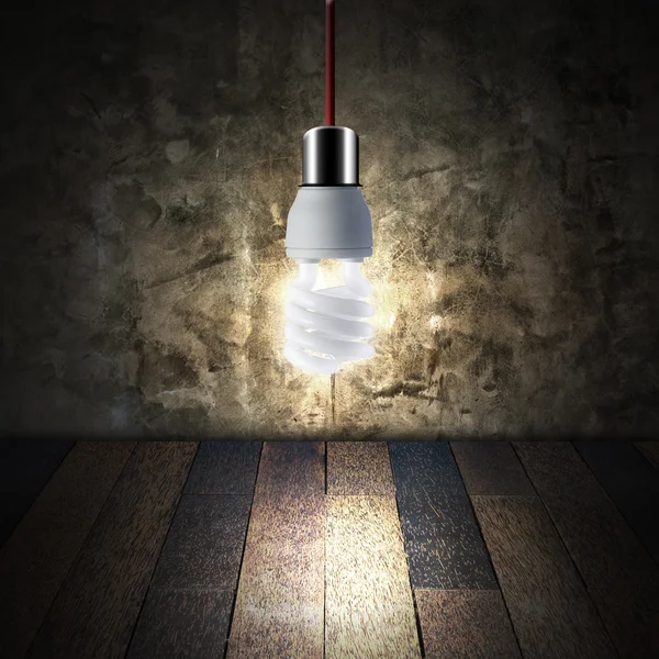 Light bulb in empty room — Stock Photo, Image