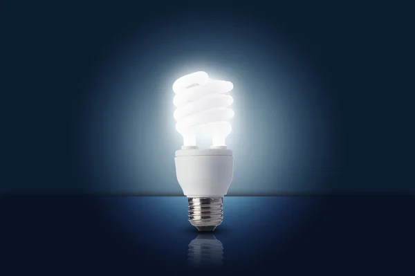 Light bulb turn on in dark room — Stock Photo, Image