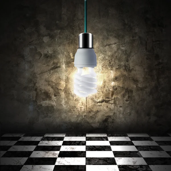 Light bulb in empty room — Stock Photo, Image