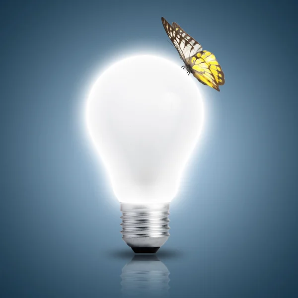 Butterfly on light bulb — Stock Photo, Image