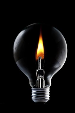 Fire and smoke in side the light bulb clipart