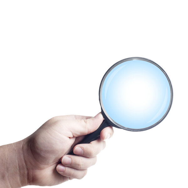 Man's hand, holding classic styled magnifying glass
