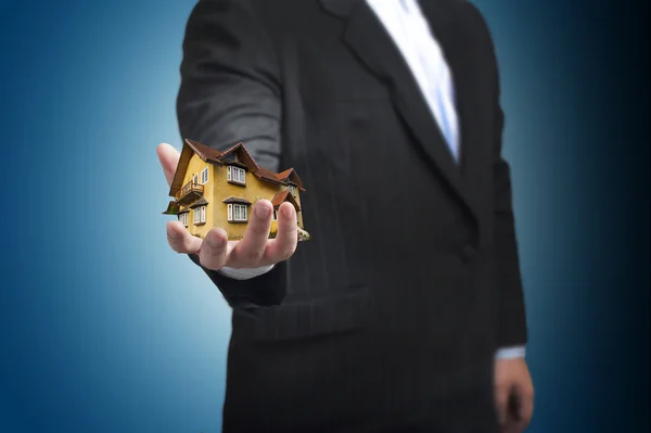 House in business man's hand. — Stock Photo, Image