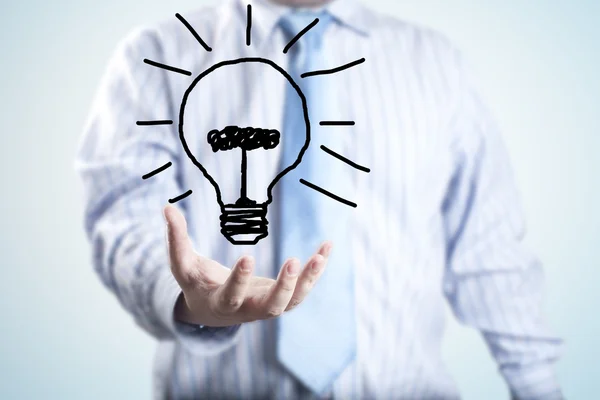 Male businessman with light bulb Royalty Free Stock Photos