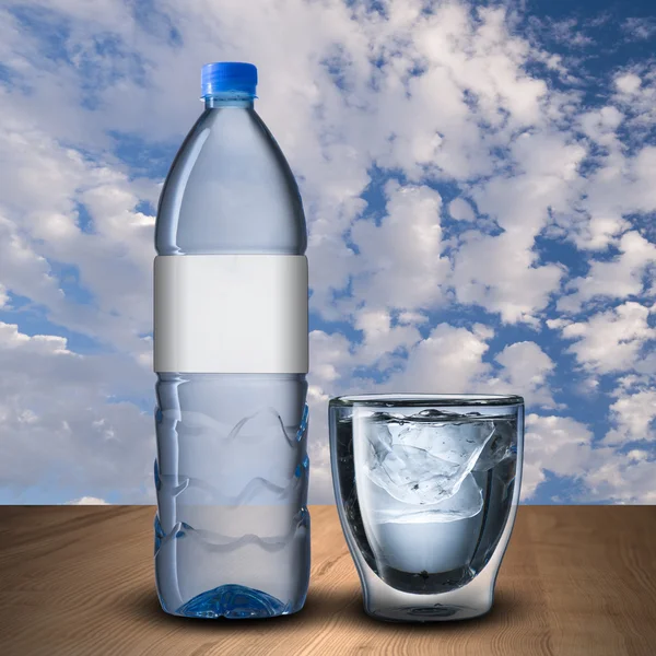 Glass and bottle of water — Stock Photo, Image