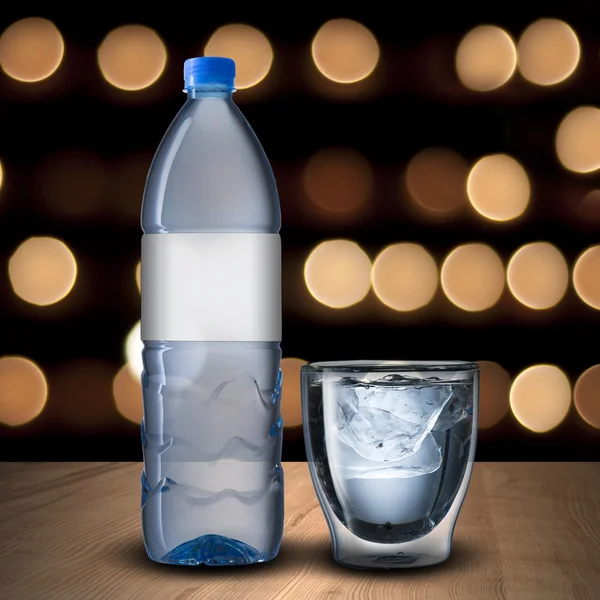 Glass and bottle of water — Stock Photo, Image