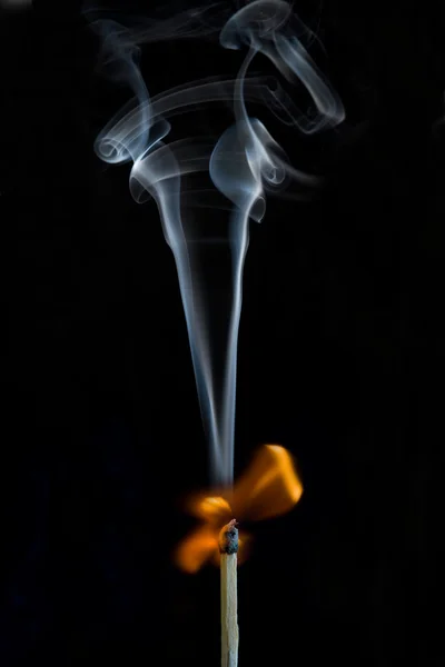 Match ignition with smoke — Stock Photo, Image