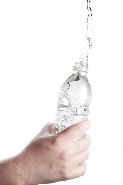 Human hand holding a bottle of water with water splash — Stock Photo, Image