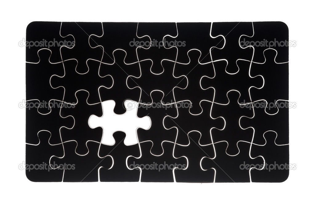 Black jigsaw puzzle with missing piece