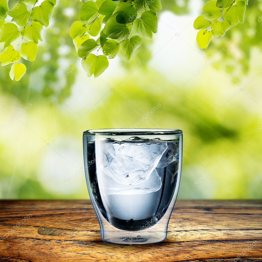 Glass of Water on wood table — Stock Photo © somchaij 38347435