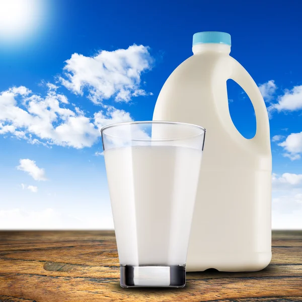 Milk on wood table — Stock Photo, Image