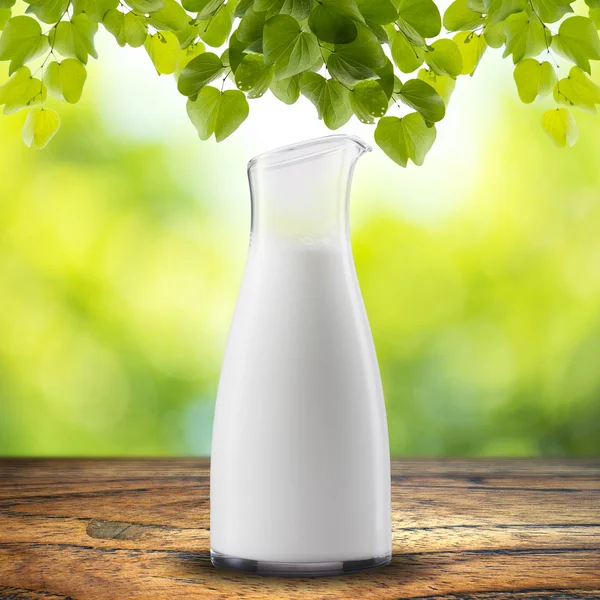 Milk with leaves — Stock Photo, Image