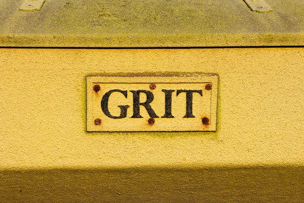 Closeup to the words on a grit container — Stock Photo, Image
