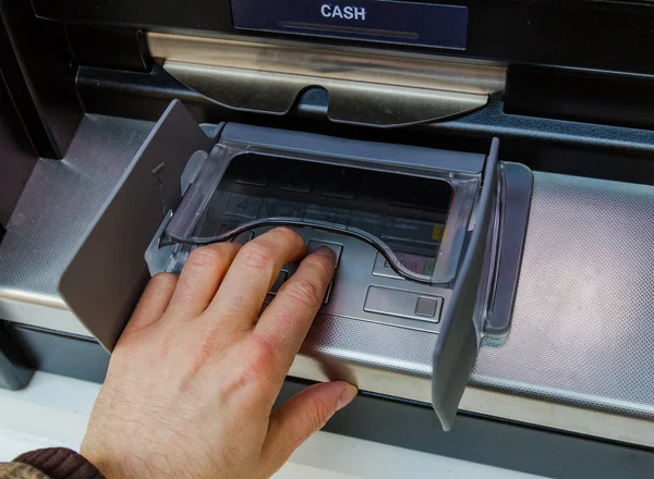 Man Entering Pin into an ATM — Stock Photo, Image