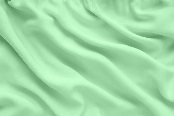 Green Silk Texture Abstract Background Luxury Fabric Wavy Folds Copy lizenzfreie Stockbilder