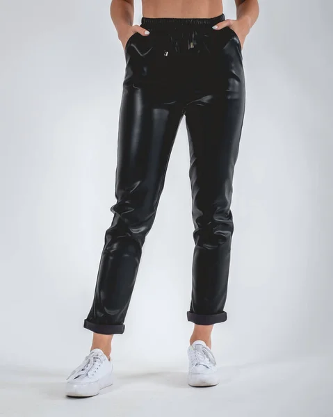 Sexy Girl Legs Feet Black Bright Leatherette Pants White Sneakers —  Fotos de Stock