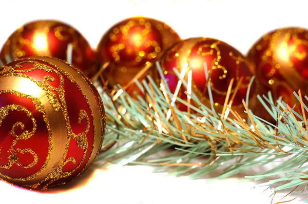 Composition Christmas red balls with gold pattern and tinsel Royalty Free Stock Images