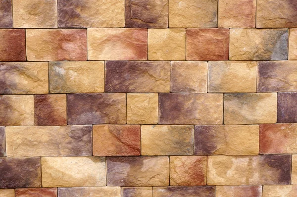 Wall texture of different colored stone blocks — Stock Photo, Image