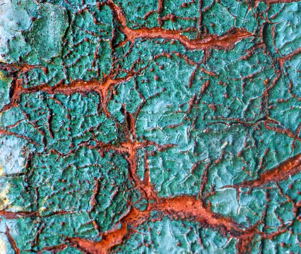 Texture de surface avec peinture fissurée - turquoise et rouge gros plan — Photo