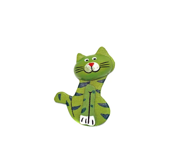 One wooden cat figure brightly painted in green — Stock Photo, Image