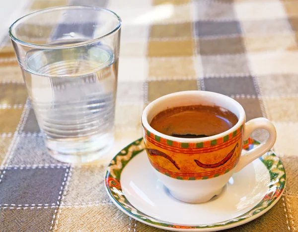 Strong Cypriot coffee with water water in a glass — Stock Photo, Image