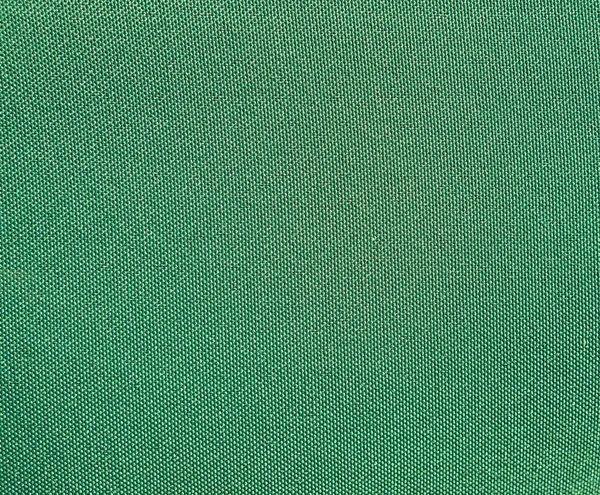 Texture of a green woven synthetic waterproof fabric — Stock Photo, Image