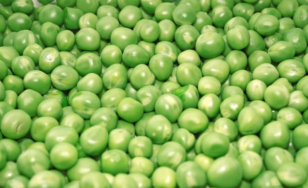 Pois verts de pois gros plan comme fond — Photo