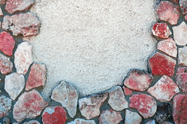 Textura de pared con grandes piedras blancas, grises y rojas — Foto de Stock