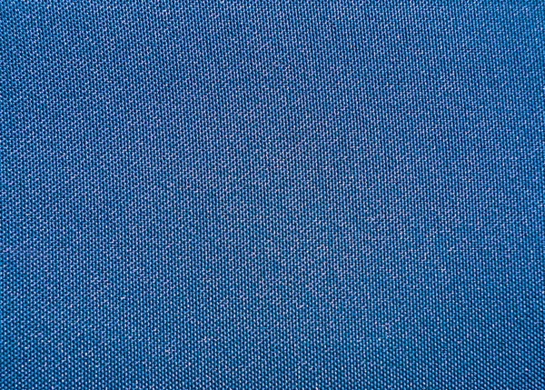 Textura de un primer plano de tela impermeable sintética azul — Foto de Stock