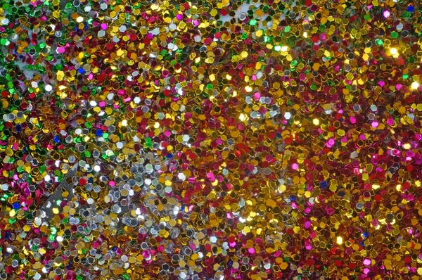 Small multicolored sequins as background — Stock Photo, Image