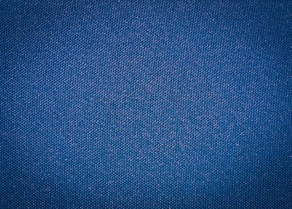 Textura de una tela impermeable sintética tejida azul — Foto de Stock