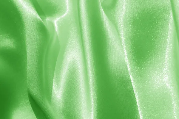 Green silk fabric background — Stock Photo, Image