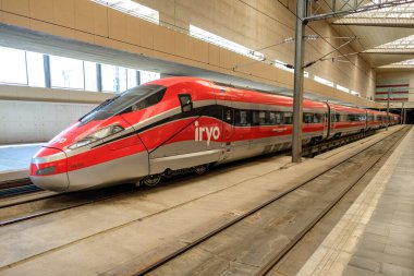 Zaragoza, Spain - august, 2022. A high speed train from Iryo is on the railroad at Delicias Station. This new transport from ILSA italian company offers low cost train trip from Madrid to Barcelona