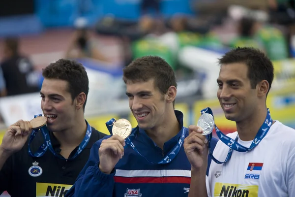 SWM: zwemmen Wereldkampioenschap - mens 100m vlinderslag finale. Raphael munoz, michael phelps, milorad cavic — Stockfoto