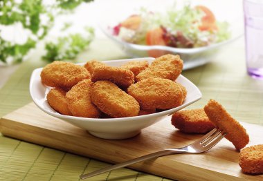 Chicken nuggets in a white bowl clipart