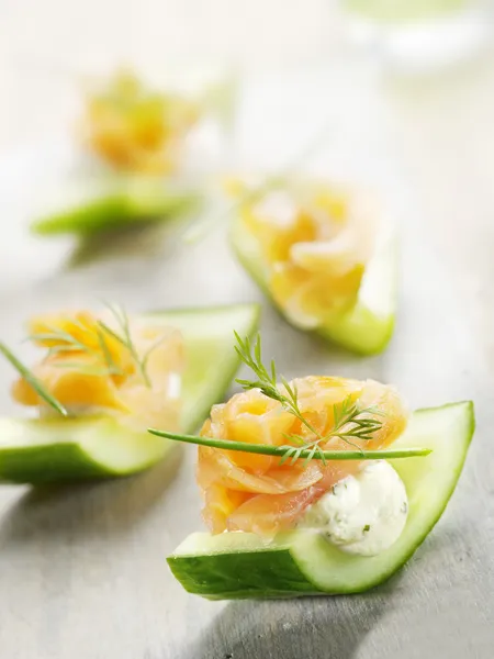 Cucumber filled with cheese and smoked salmon — Stock Photo, Image