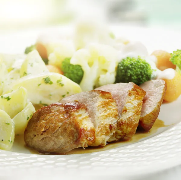 Grilled ham served with cauliflower broccoli carrot and potatoe — Stock Photo, Image