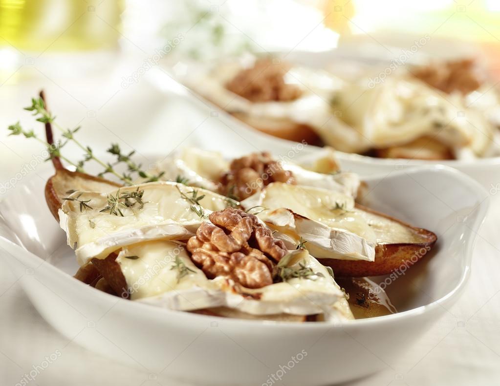 tasty baked pear with brie honey walnut and thyme