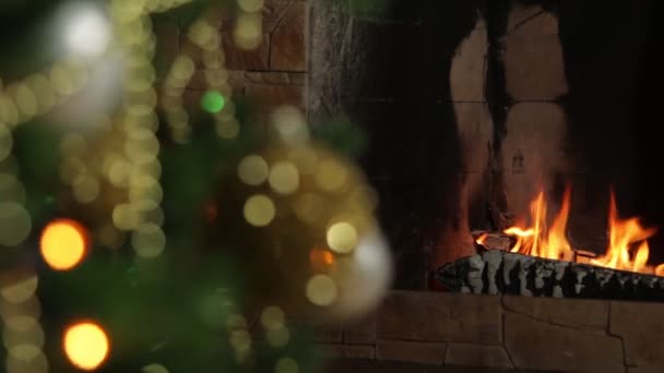 Celebrating New Years Christmas Home Focus Burning Fireplace Rotating Ball — Stock Video