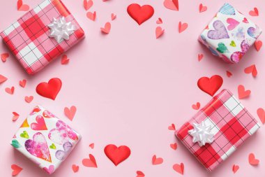 Mother's day valentine christmas. Gift boxes with hearts on a pink pastel background.